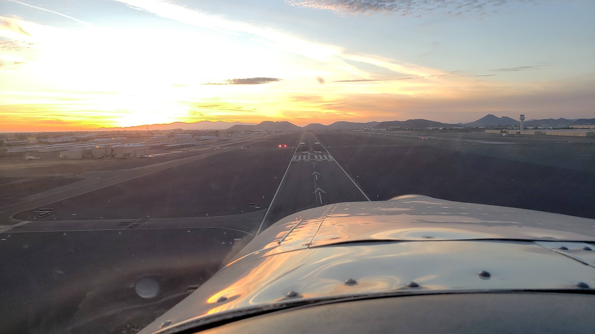 Runway viewed from an airplane on final approach
